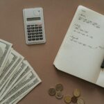 top view photo of notebook near money