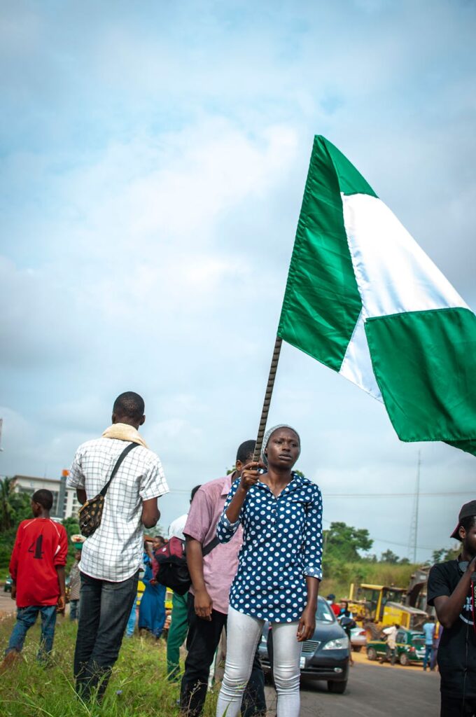 woman with flag on street protest