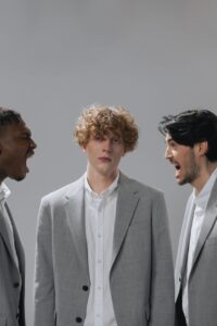 men shouting beside a person