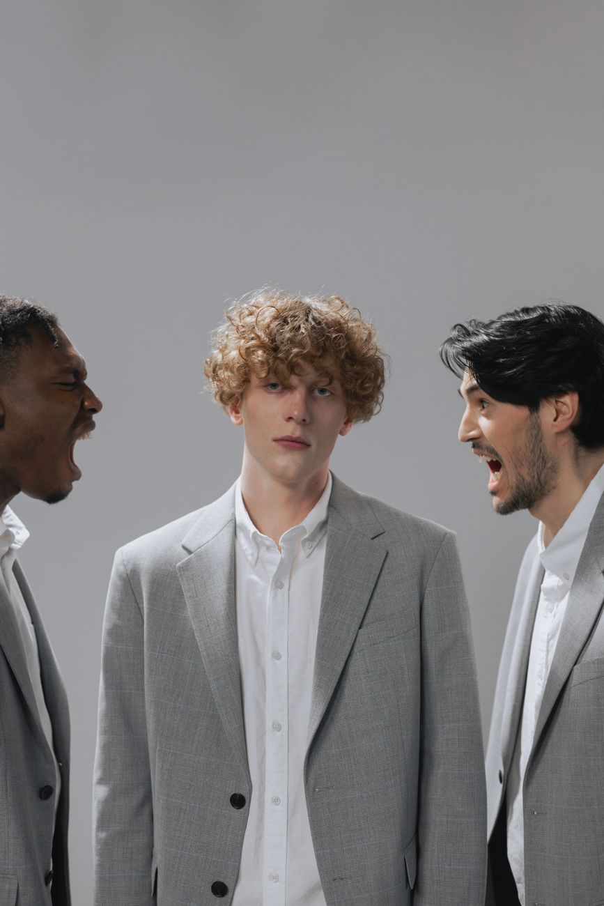 men shouting beside a person