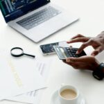 photo of person using calculator