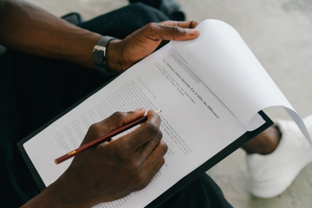 close up of man looking at a document with an autism test