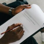 close up of man looking at a document with an autism test