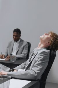 man in gray suit taking a rest while seated