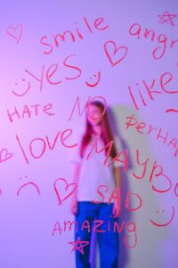 teenage girl behind glass with words