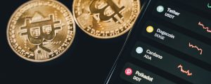 mobile phone beside bitcoins