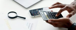 photo of person using calculator