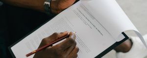 close up of man looking at a document with an autism test
